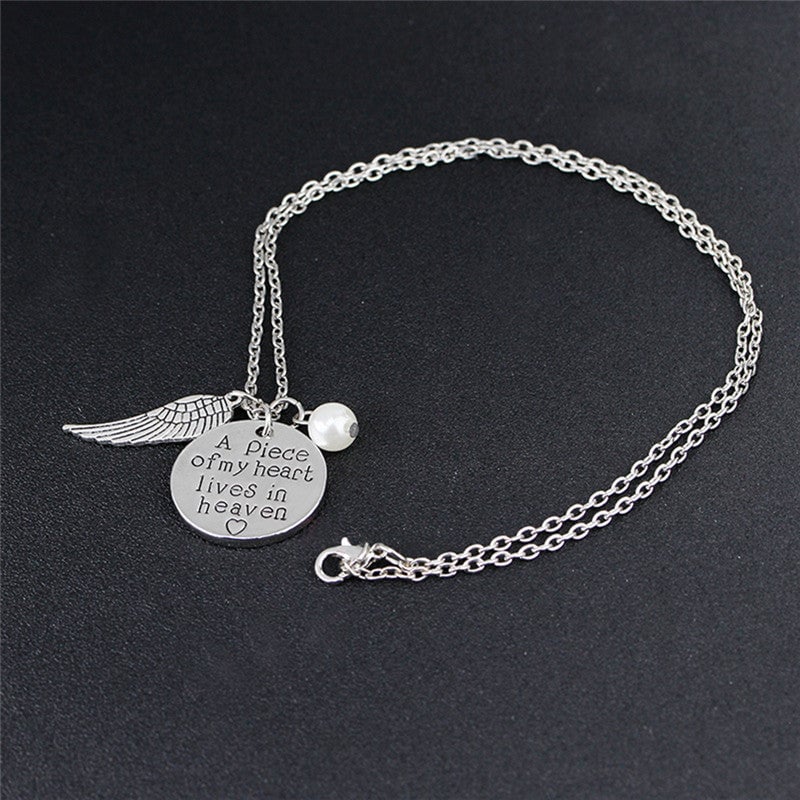 Angel Wing Necklace with Pearl - Engraved Round - "A piece of my heart lives in heaven"