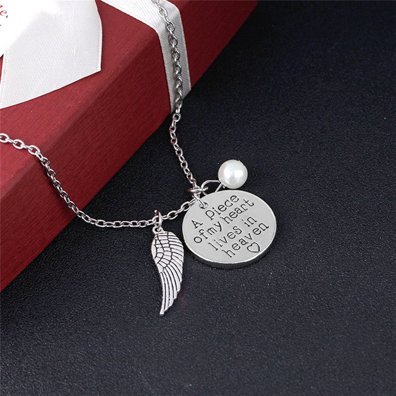 Angel Wing Necklace with Pearl - Engraved Round - "A piece of my heart lives in heaven"