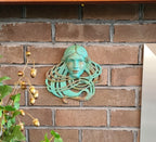 Art Nouveau inspired sculpture of beautiful female face with long stylised hair