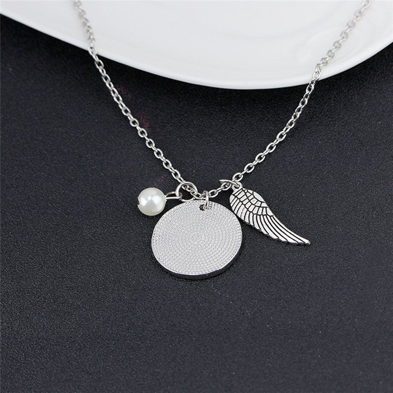 Angel Wing Necklace with Pearl - Engraved Round - "A piece of my heart lives in heaven"